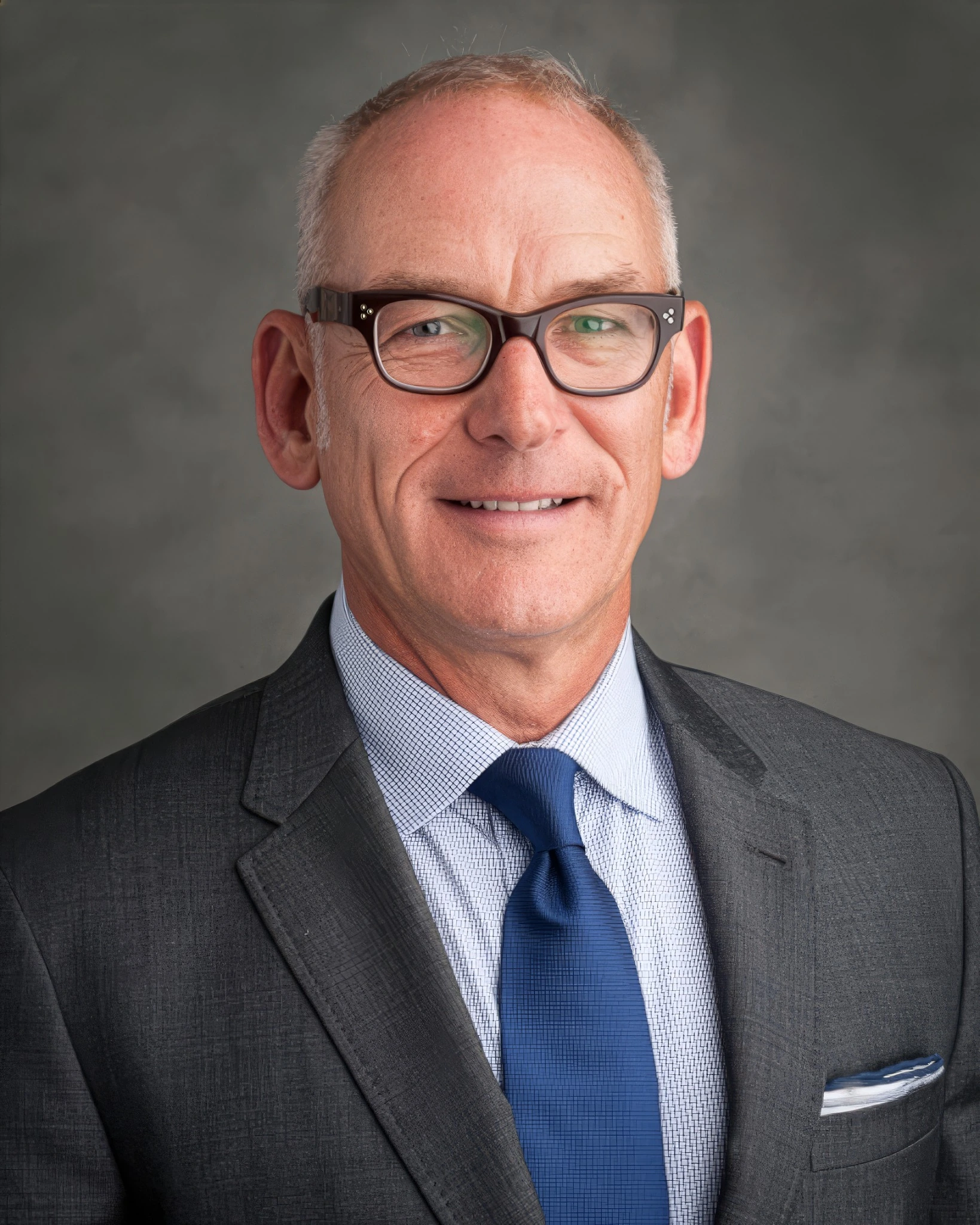 Man in glasses wearing a suit