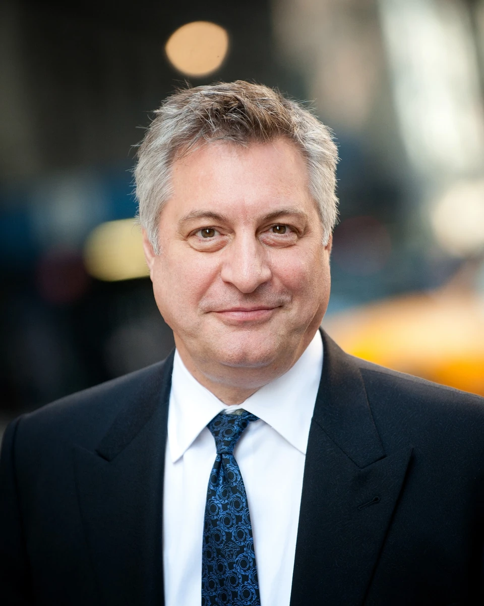 Man in a suit with a softly blurred background