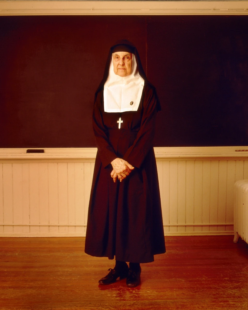 Nun standing on a stage